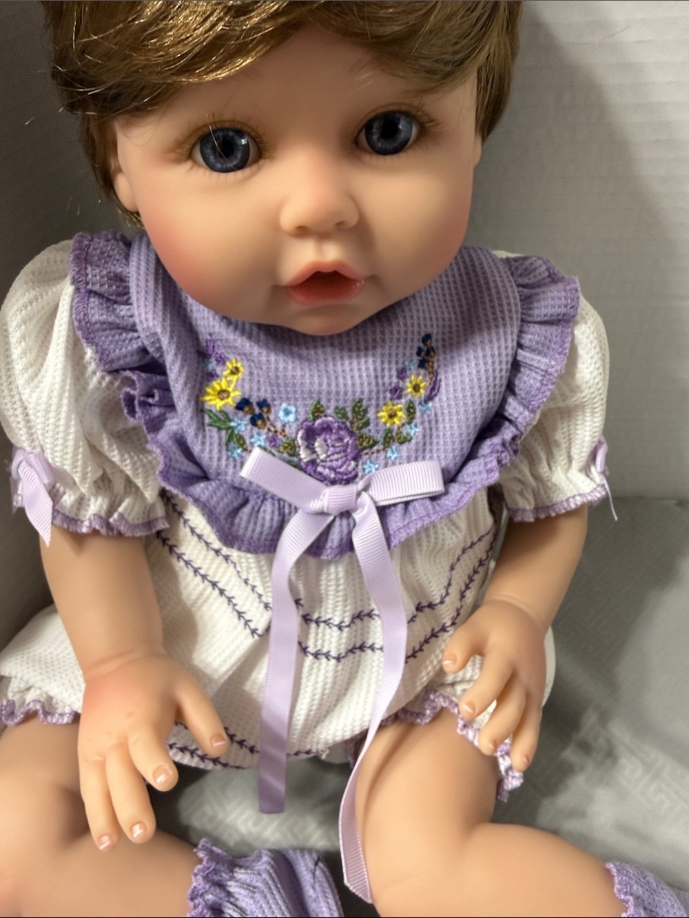 Aori Reborn Lifelike Baby Girl Doll in Lavender Embroidered Outfit Soft Body - Picture 3 of 10